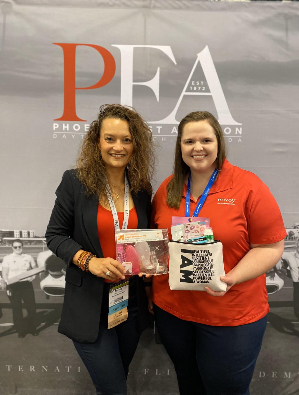 Amelie Coleman, Admissions Manager, pictured with merch giveaway winner at WAI Conference 2021