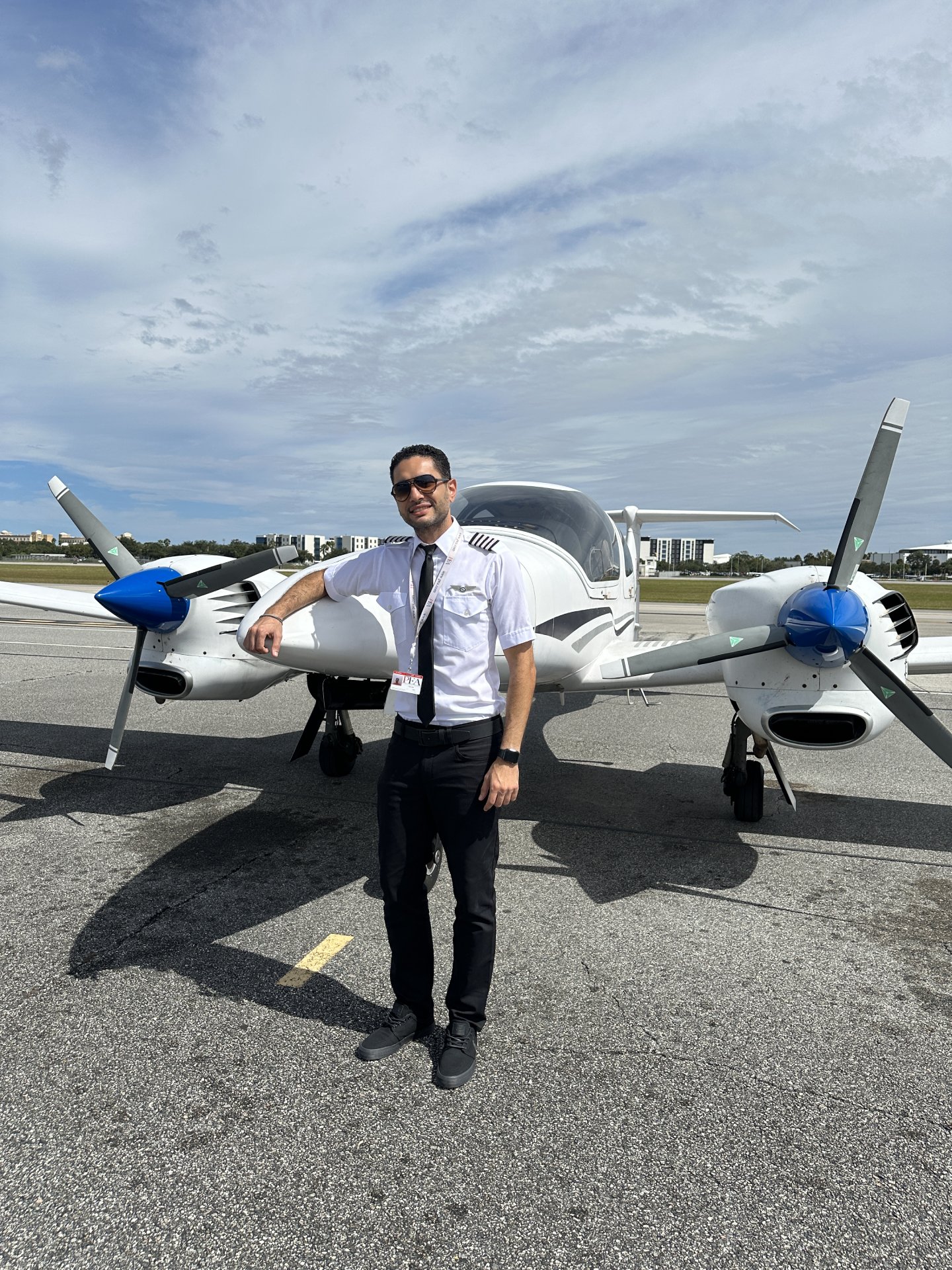 Peter Gad in front of Diamond DA42 on tarmac