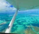 Overlooking the Florida Keys from Cessna window and can see the wing in photo
