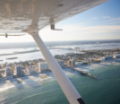 Scenic shot overlooking Daytona Beach coastline featuring Cessna 172 Wing