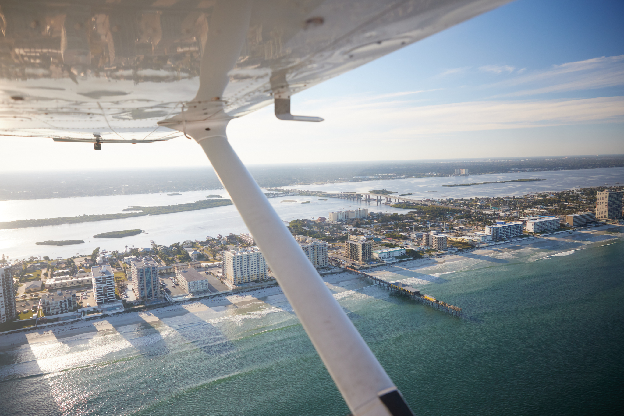 Scenic shot overlooking Daytona Beach coastline featuring Cessna 172 Wing