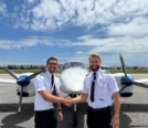 Brenton Scott Martin (on the right) shaking hands with his student Gaurang Gang (on the left), in front of Diamond DA42