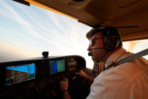 a male pilot flying a plane