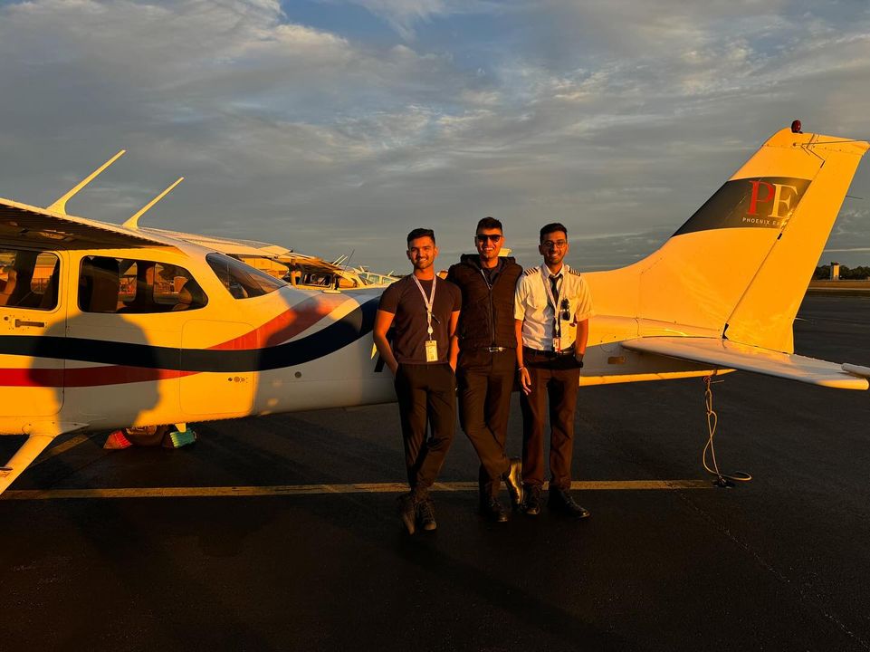 Ashish Raj and Tegvir Anand next to Cessna 172 during sunset on KFIN tarmac