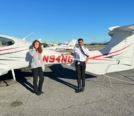 Charli Haddican on the left with Ashish Raj on the right standing by DA42 N94NG