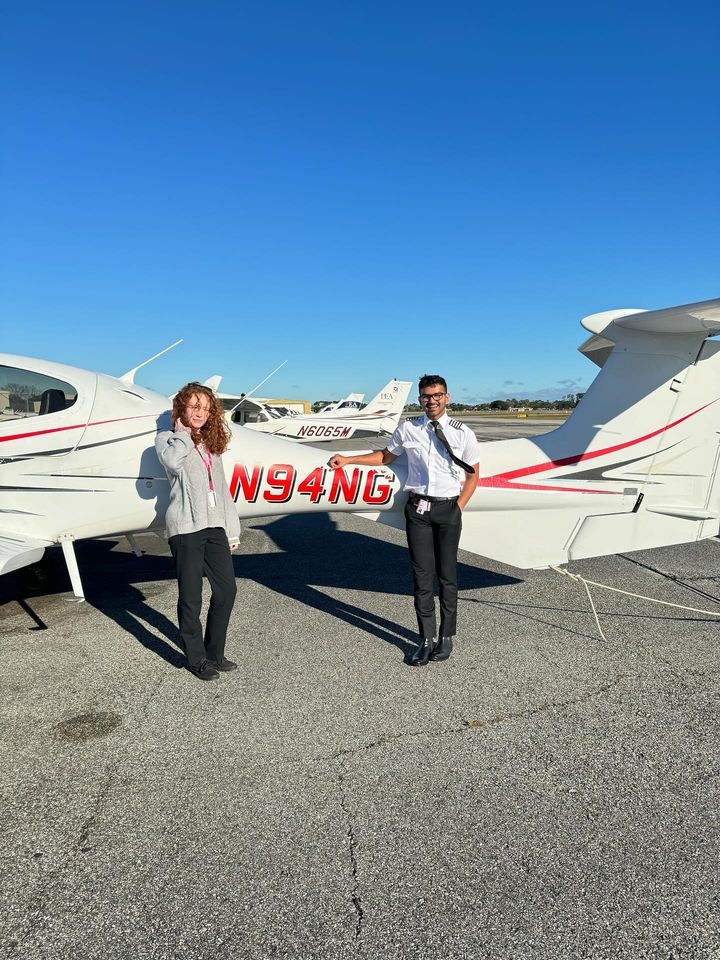 Charli Haddican on the left with Ashish Raj on the right standing by DA42 N94NG