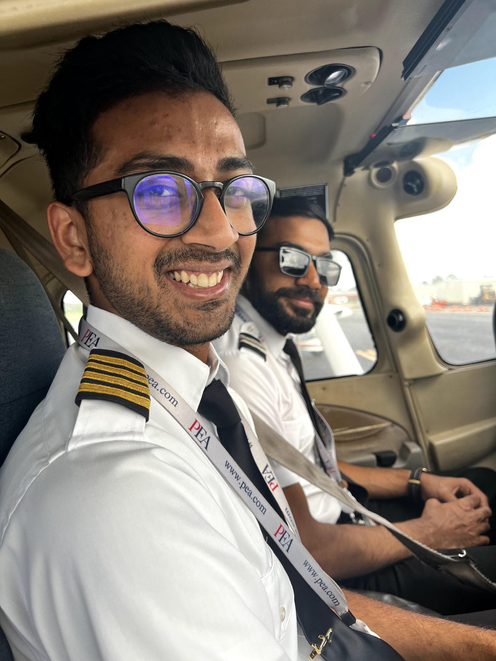 TNC student and instructor at KFIN close up shot sitting inside of PEA Cessna 172