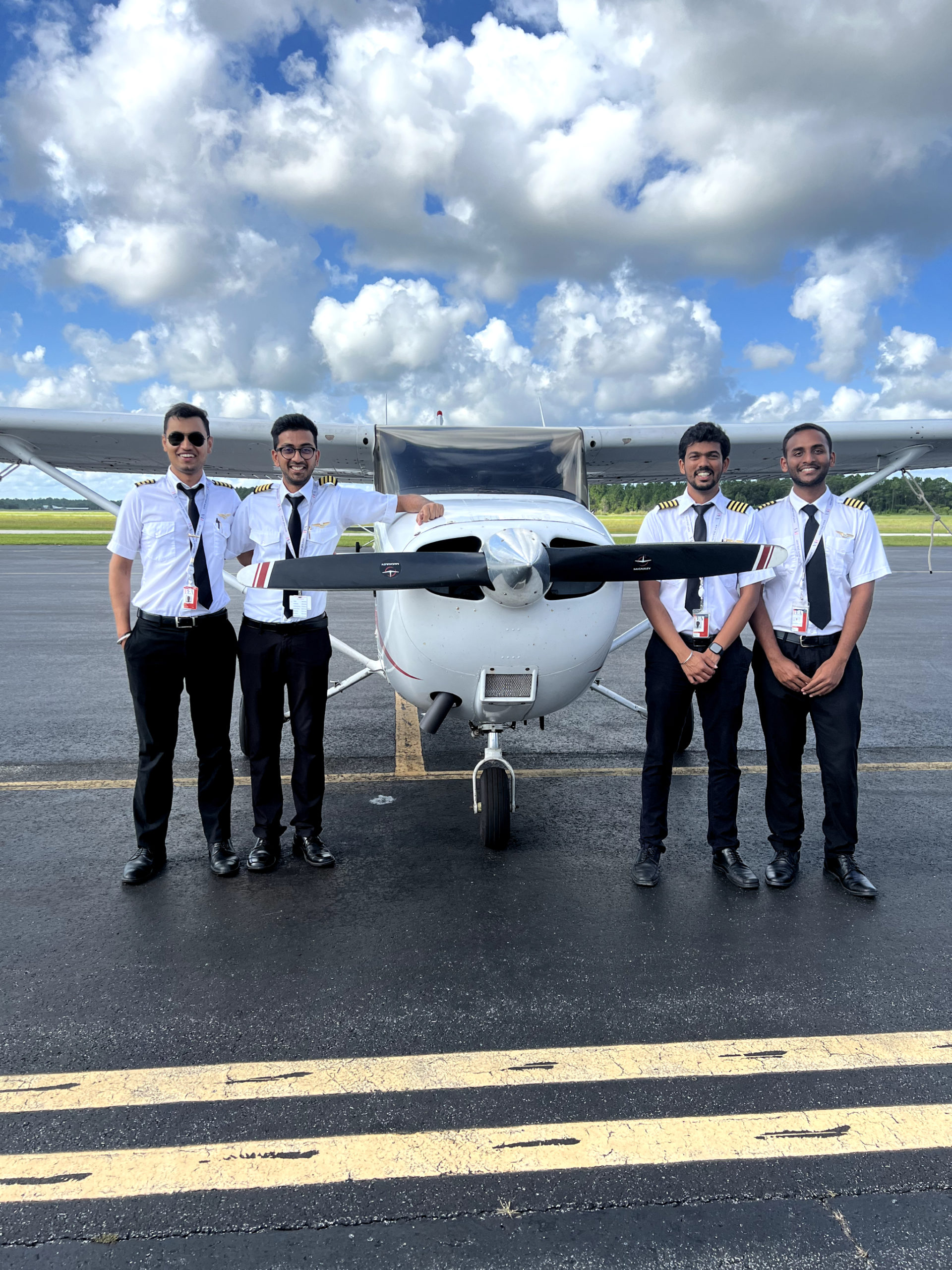 TNC students now instructors at KFIN PEA in front of Cessna 172 on KFIN tarmac