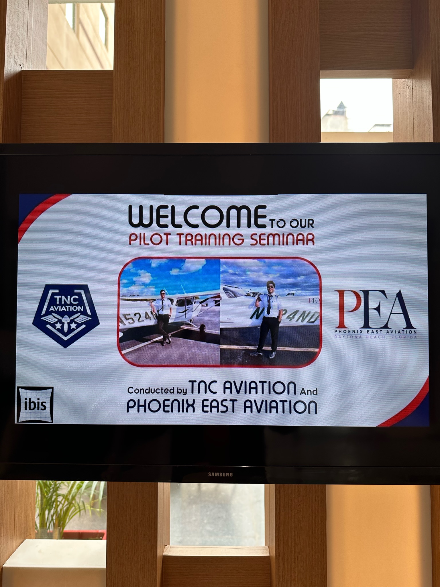 close up shot of welcome sign for TNC and PEA India seminars in April 2023