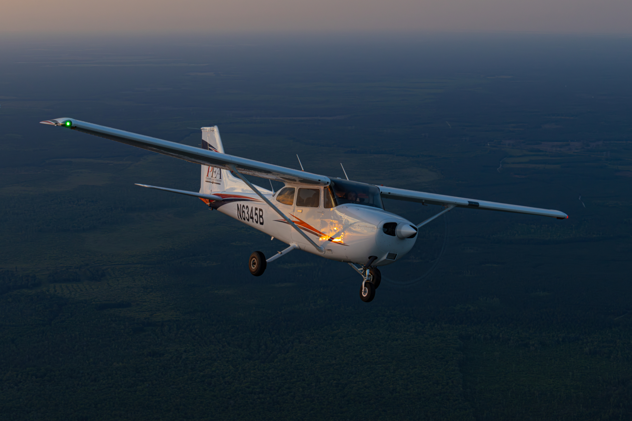 PEA Cessna N6345B in flight from formation photoshoot