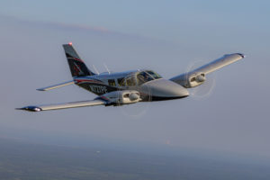 PEA Seneca N727PE in flight from formation photoshoot