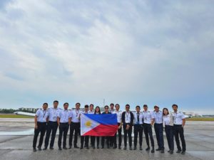 group photo of SP and IP from Philippines and Frans holding the flag in the center