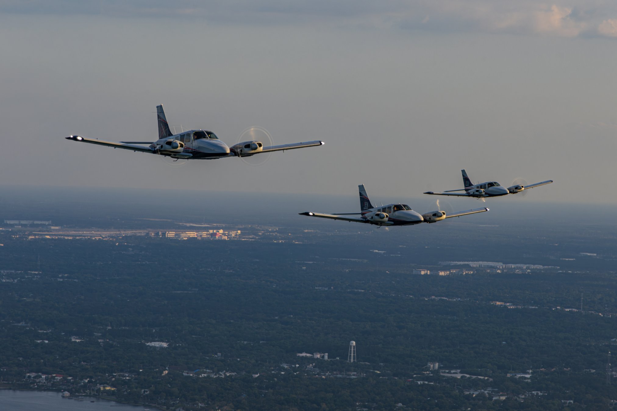 Professional in flight and formation flight of 3 PEA Piper Senecas flying in Daytona Beach, Florida