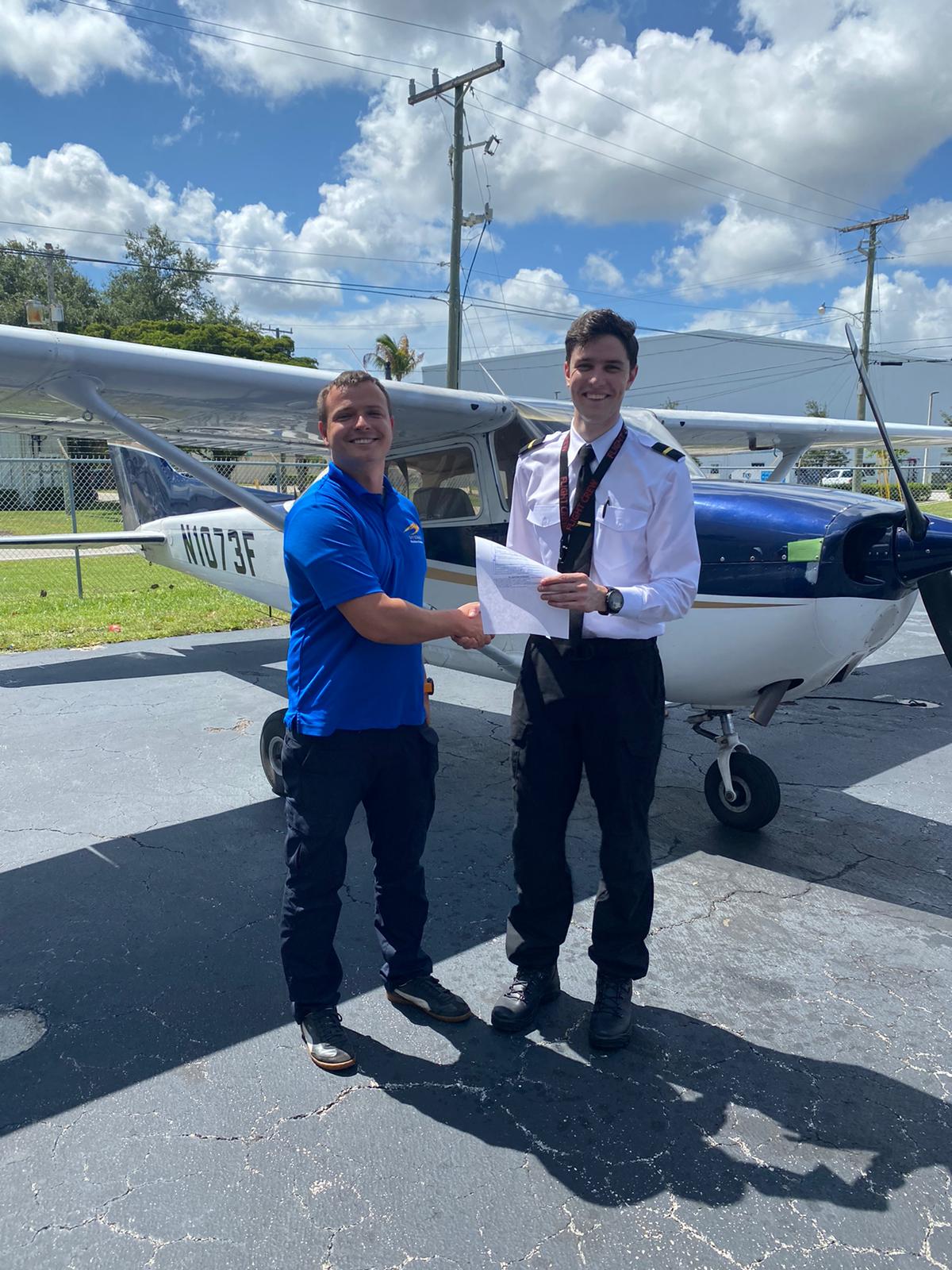 Dan Zagorii(R) shaking instructor Dylan's(L) hand, after receiving PPL