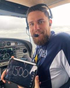 Dan Zagorii holding iPad Showcasing 1500 Hours