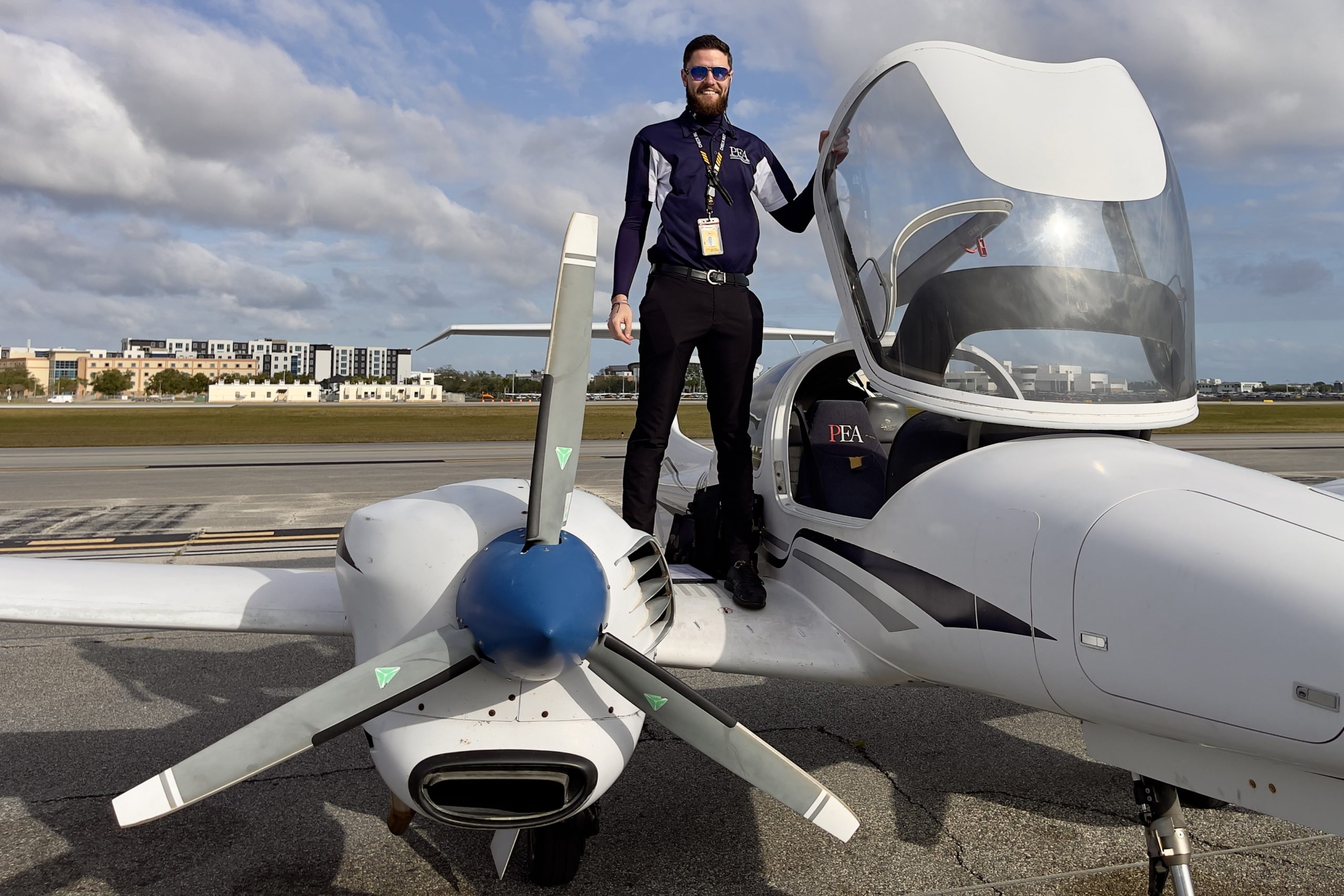 Dan Zagorii standing next to DA42 with canopy open