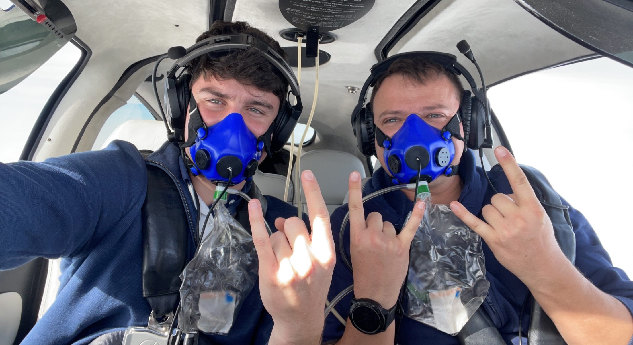Dan Zagorii(L) with Instructor, Dylan(R) high altitude unpressurized flying with supplemental oxygen mask