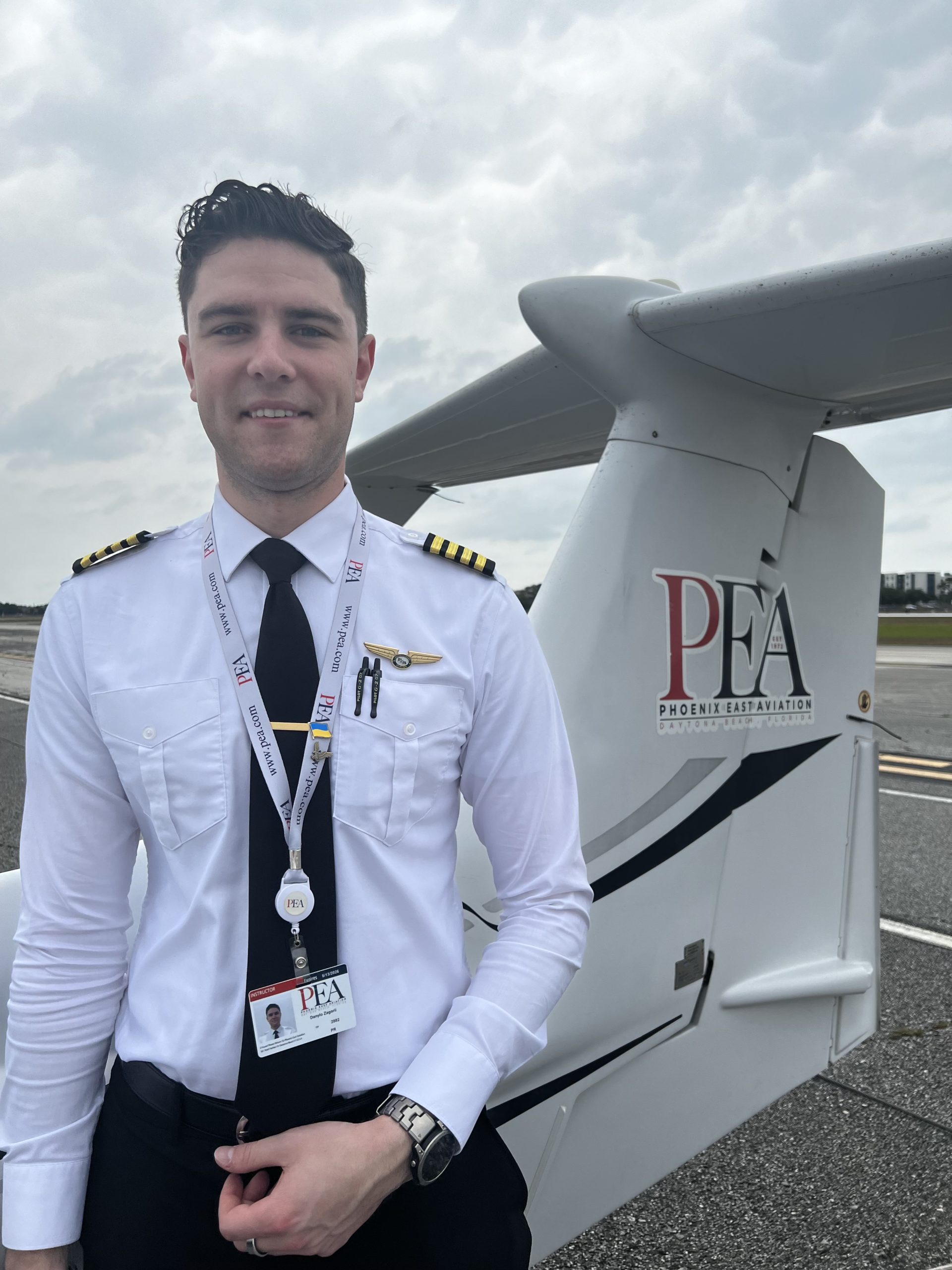 Dan Zagorii standing next to DA42 with canopy open