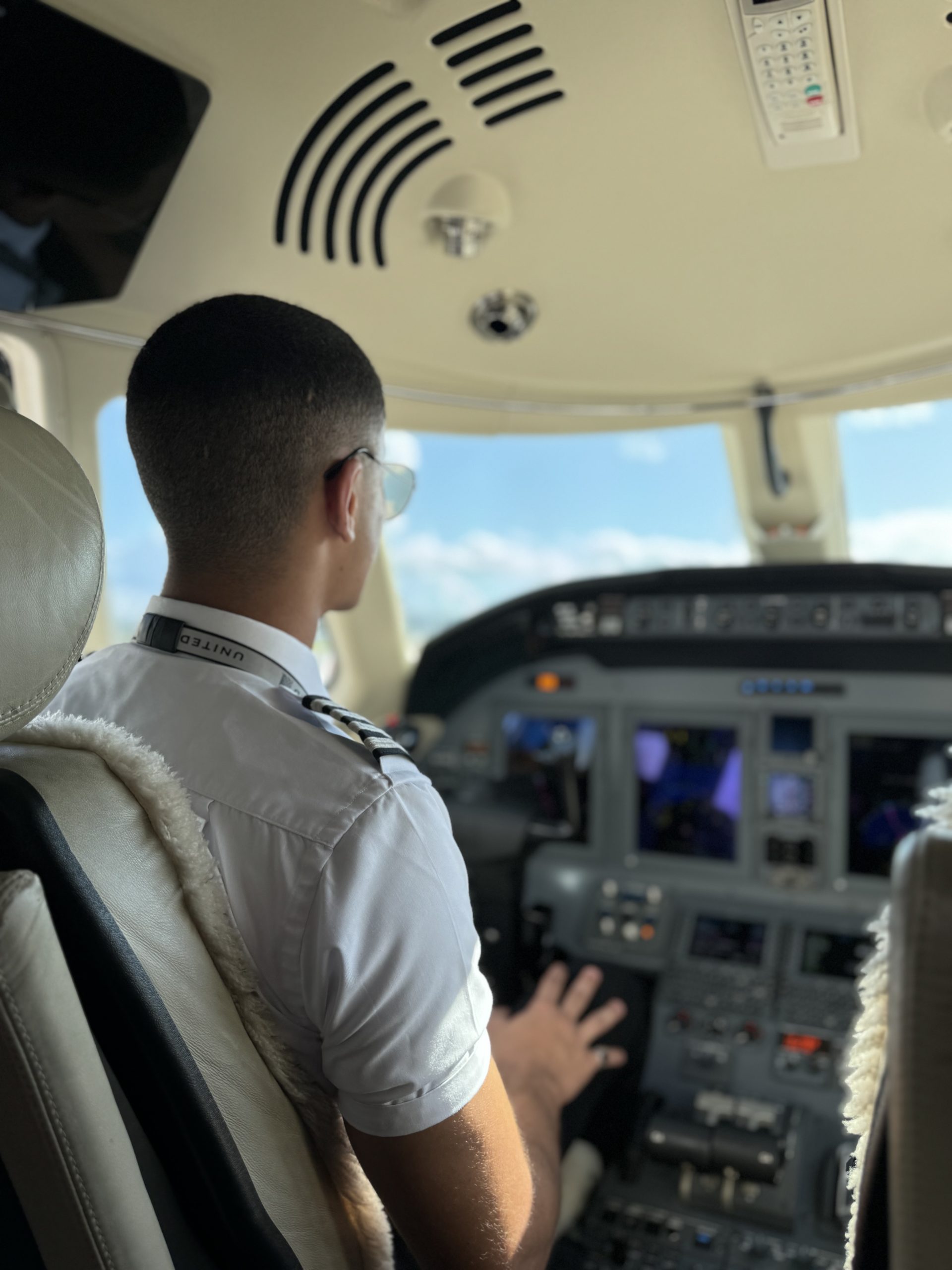 Omar Algazar OTS sitting in flight deck of aircraft
