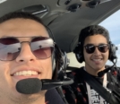 Omar Algazar photo with friend in flight