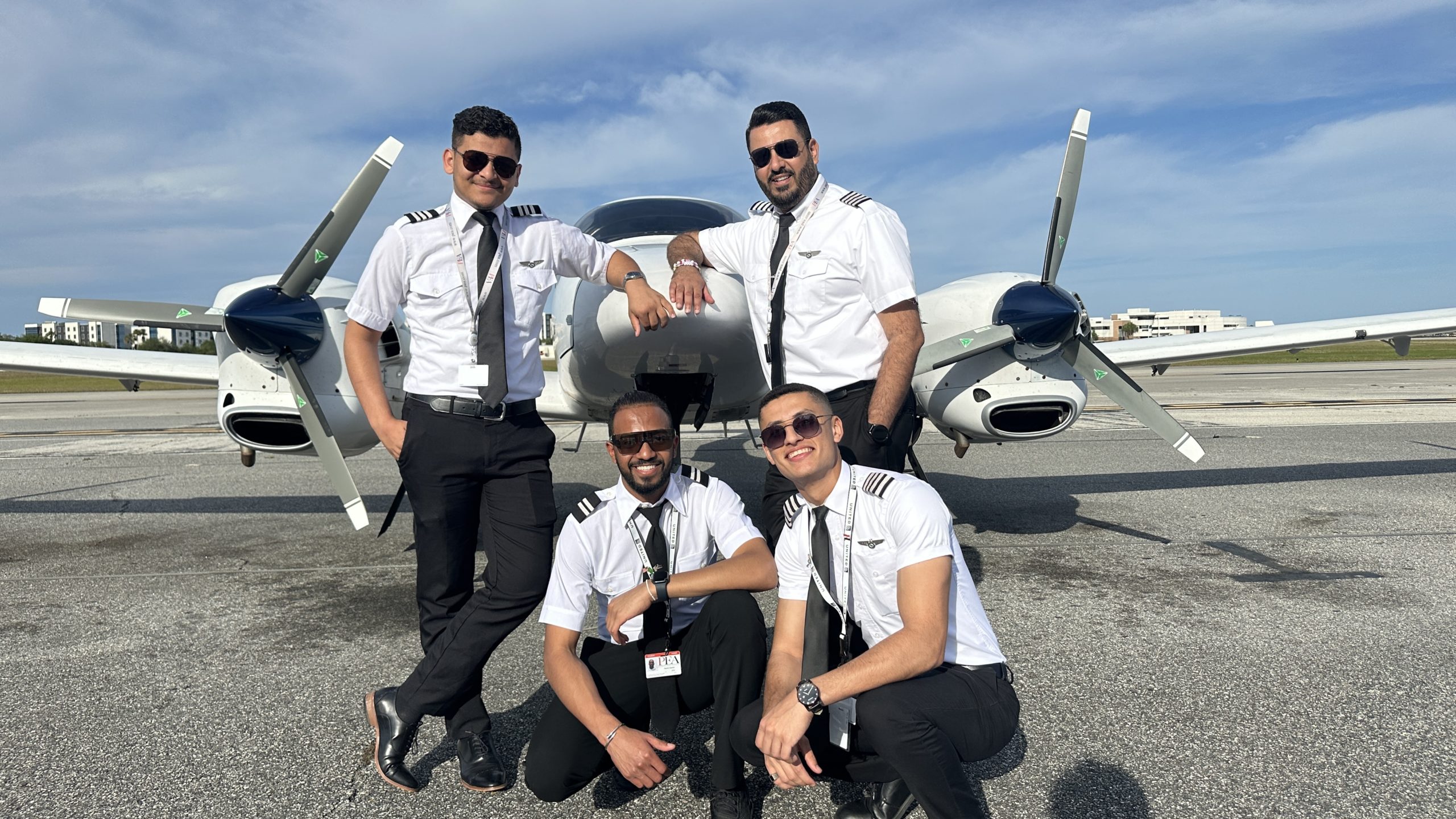 group shot of Omar (front, right) with friends in front of Diamond DA42