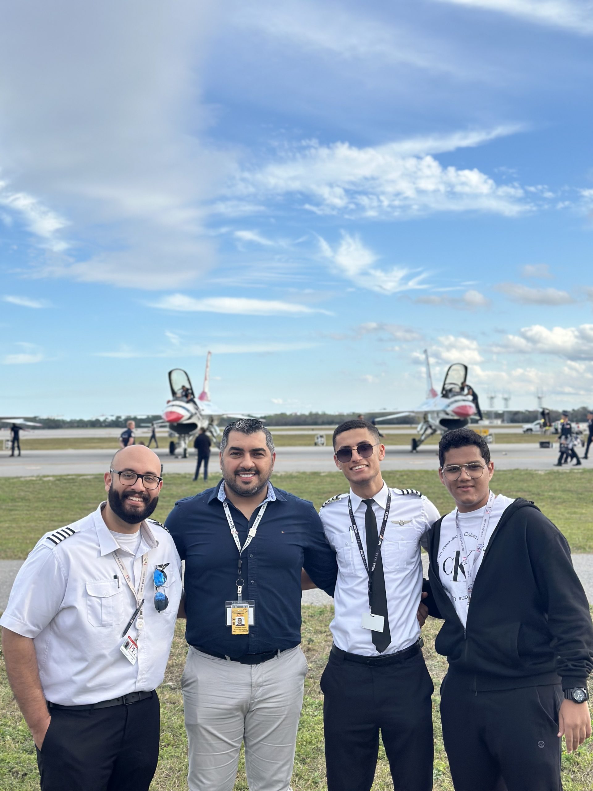 alt text=group shot of Omar (second one from the right) with friends in front of US Air Force Thunderbirds