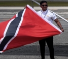 Dhaarinesh Balkison holding Trinidad and Tobago flag