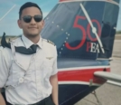 Dhaarinesh Balkisoon CFI headshot by tail of PEA 50th Piper Seneca