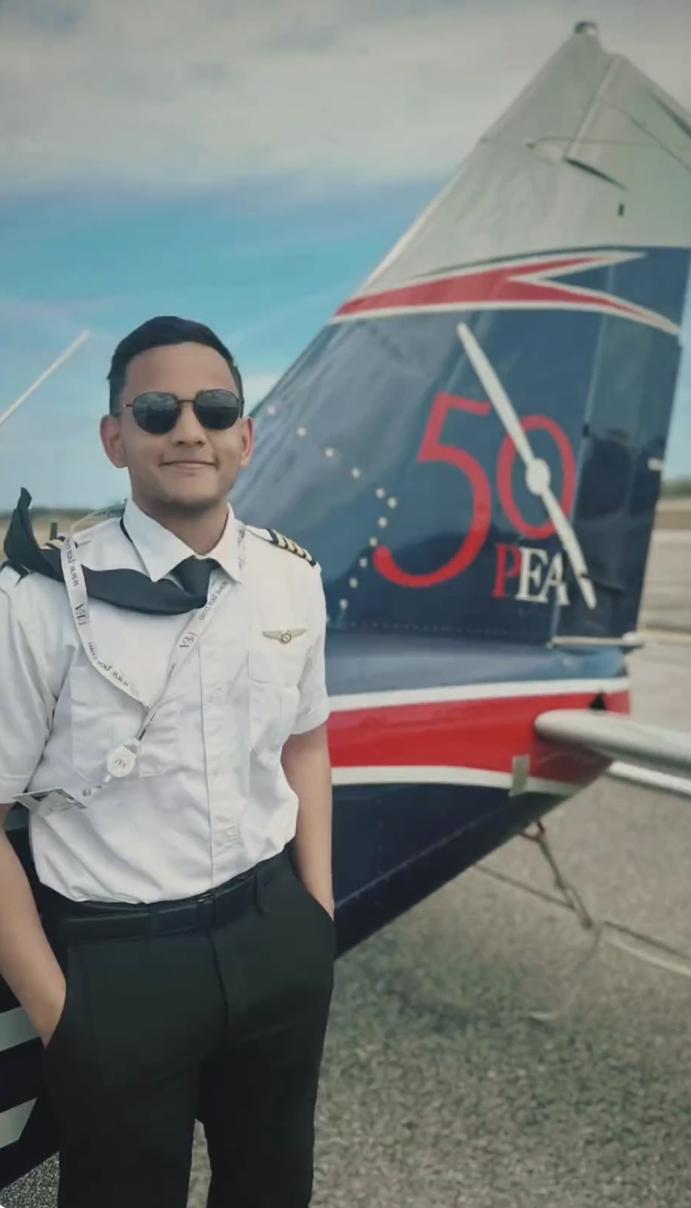 Dhaarinesh Balkisoon CFI headshot by tail of PEA 50th Piper Seneca