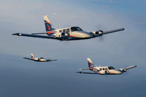 PEA's 3 Piper Senecas mid air, in clear skies, during the photoshoot