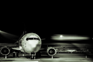 black and white commercial fleet in motion on ramp