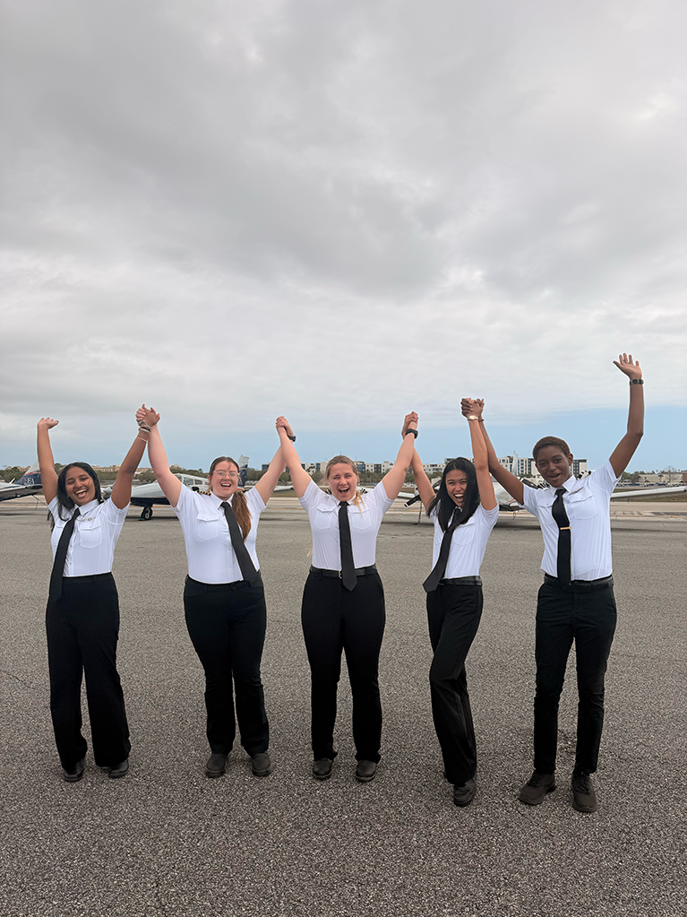 5 young pilots cheering